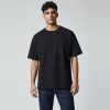 Model wearing black plain t-shirt, colour code #1A1A1A – Bulk Cloth Store