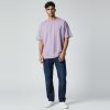 Model wearing dusty lavender plain t-shirt, colour code #B9A7C9 – Bulk Cloth Store