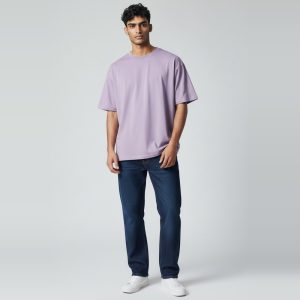 Model wearing dusty lavender plain t-shirt, colour code #B9A7C9 – Bulk Cloth Store