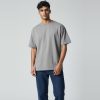 Model wearing heather grey plain t-shirt, colour code #A7A9AC – Bulk Cloth Store