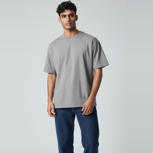 Model wearing heather grey plain t-shirt, colour code #A7A9AC – Bulk Cloth Store