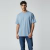 Model wearing patina blue plain t-shirt, colour code #7BA7BC – Bulk Cloth Store